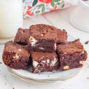 A plateful of chocolate fudge brownies on the table.