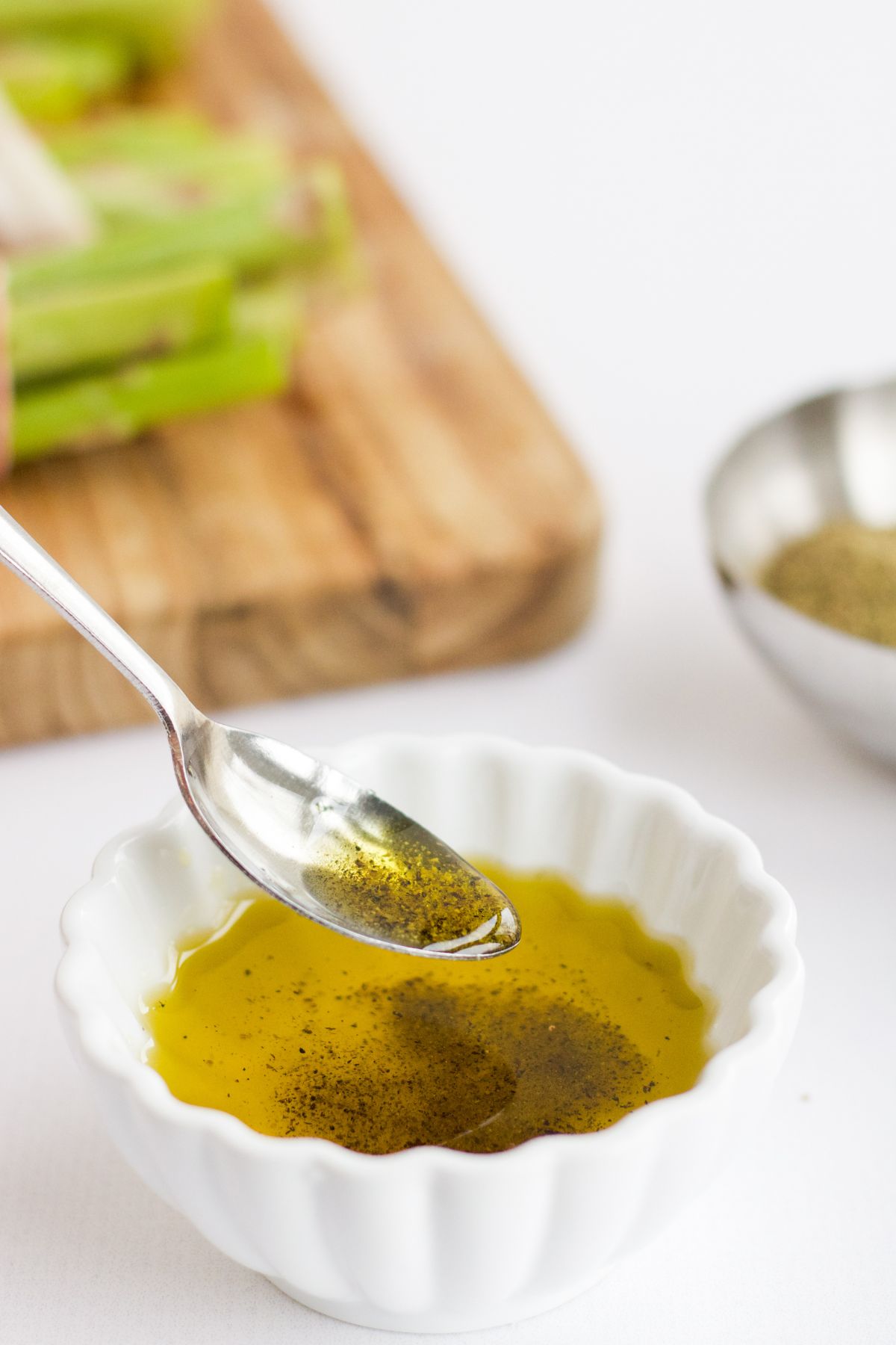 Olive oil, salt, and pepper in a small bowl.