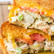 Chicken melt sandwich stacked on top of one another.