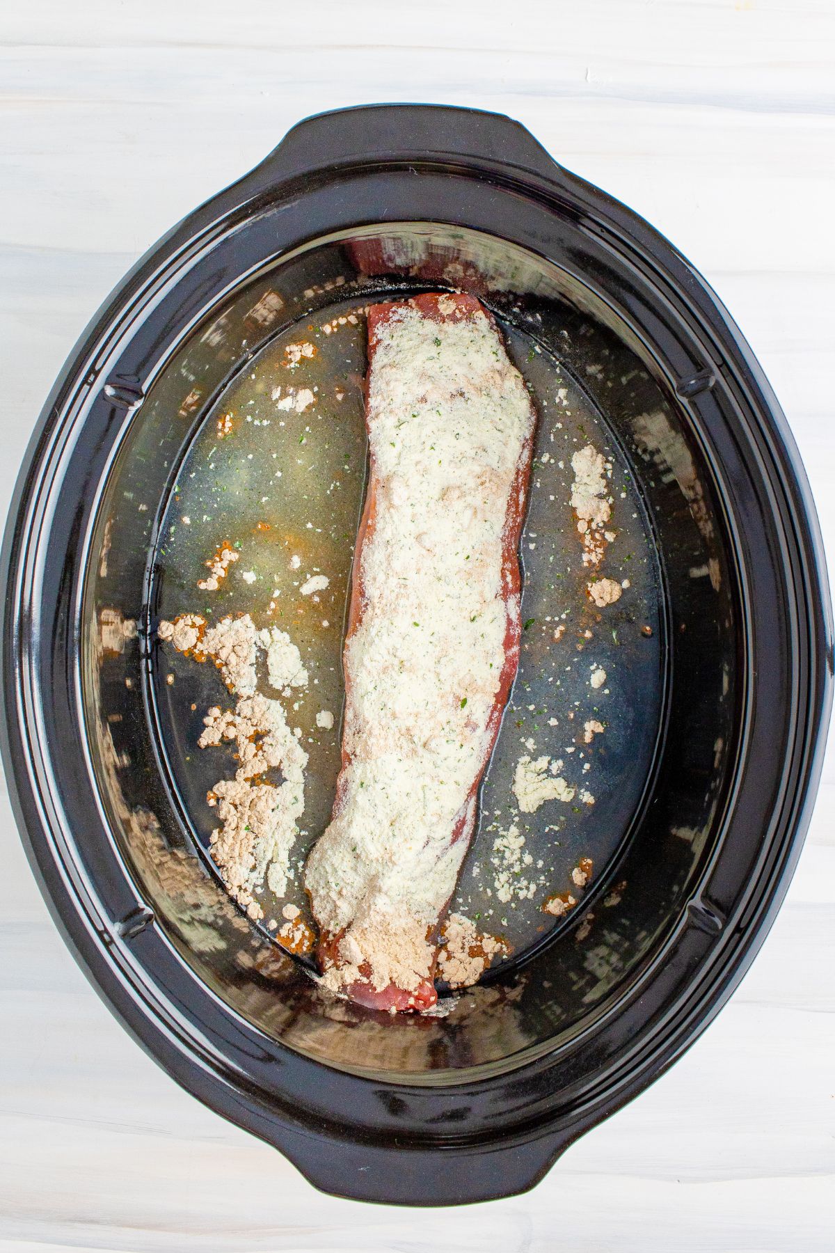 Ranch seasoning over top of the pork tenderloin.