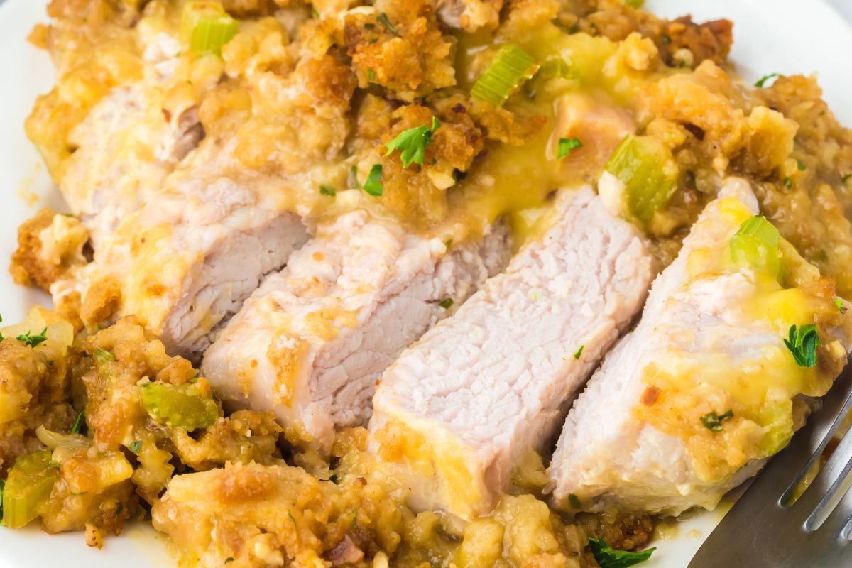 A sliced pork chop on a plate.