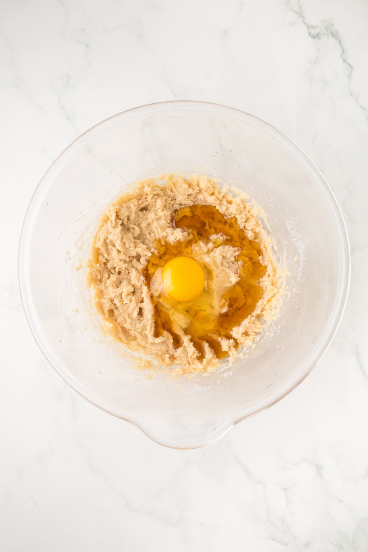 Egg and maple syrup added to the bowl.