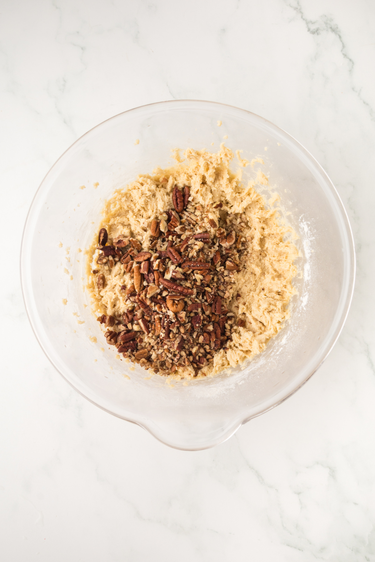 The chopped pecans added to the mixture.