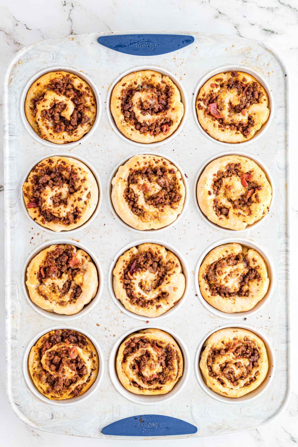 The pinwheel cooked and cheese melted on top.
