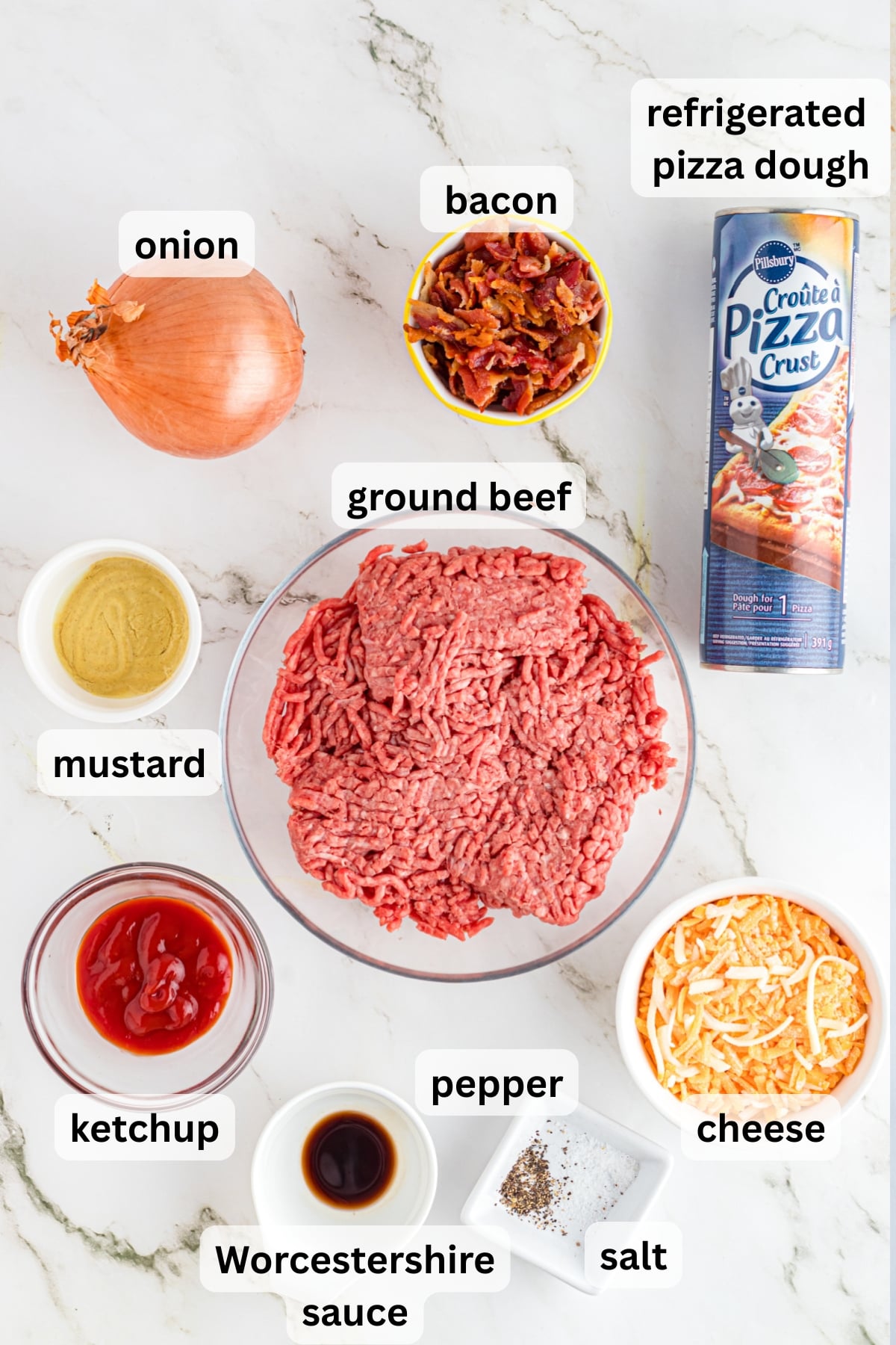 Ingredientsย to make these cheeseburger pinwheels on a table.
