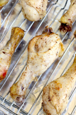 Cooked chicken on a baking tray.