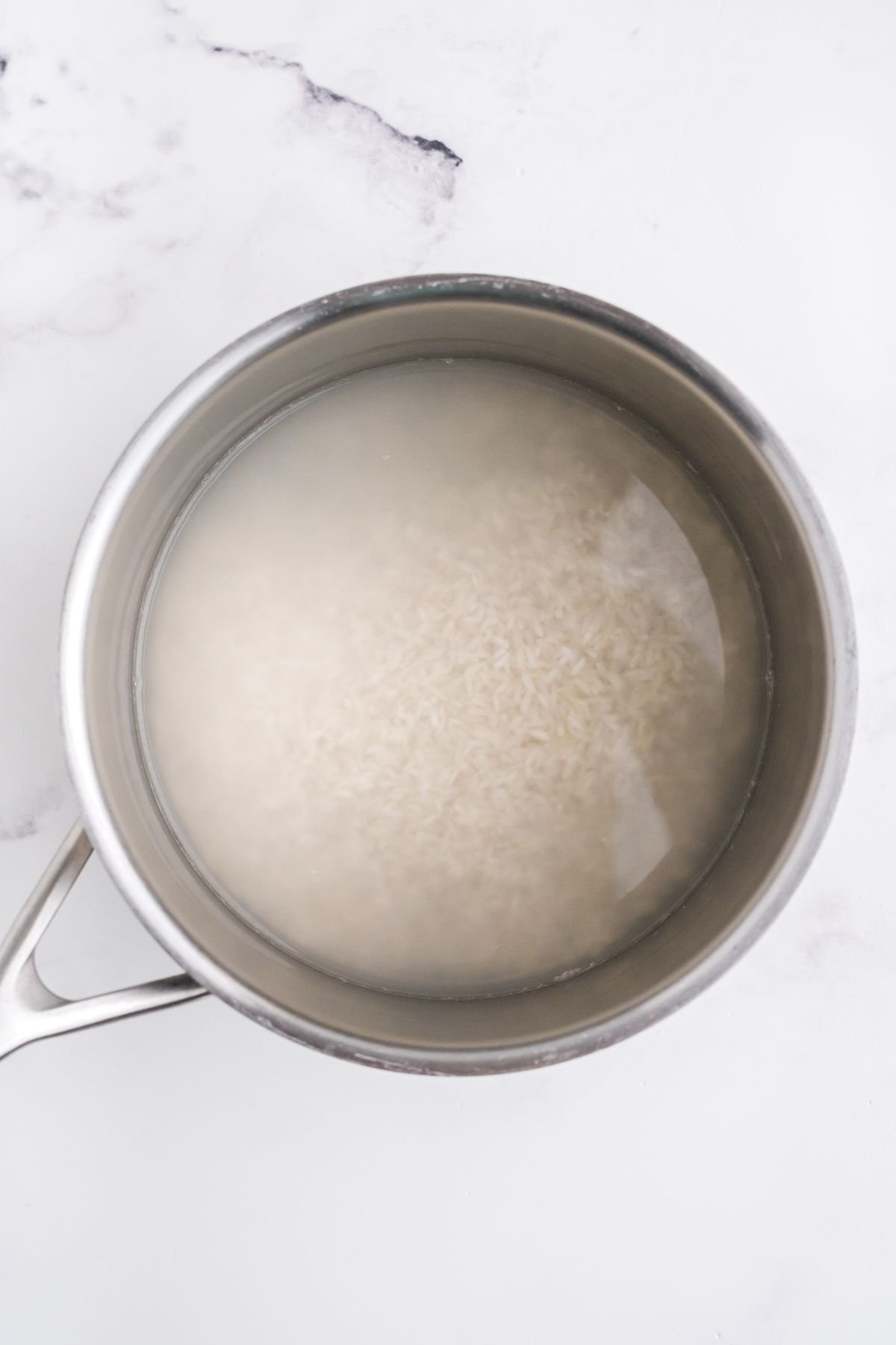 Rice and water in a large pot.
