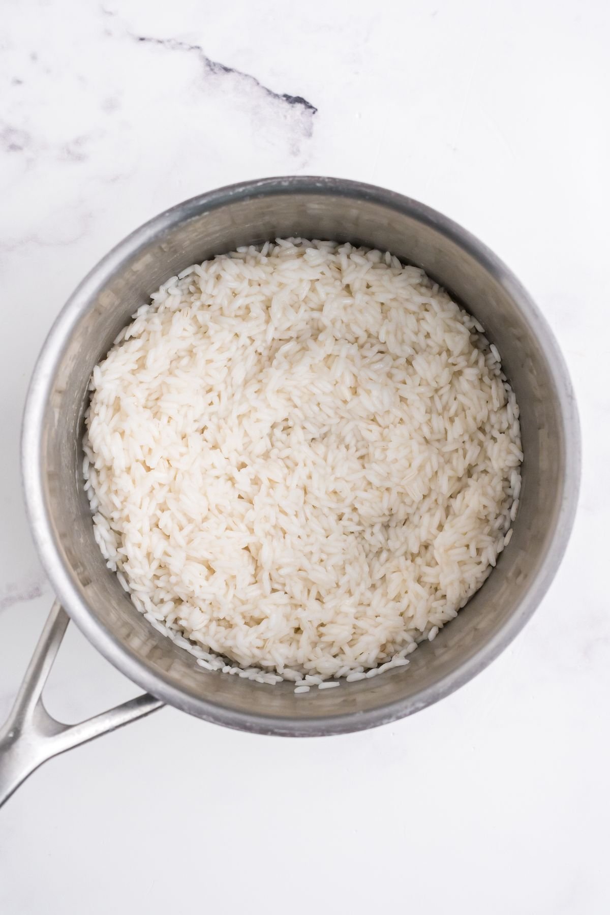 Rice cooked in a large pot.