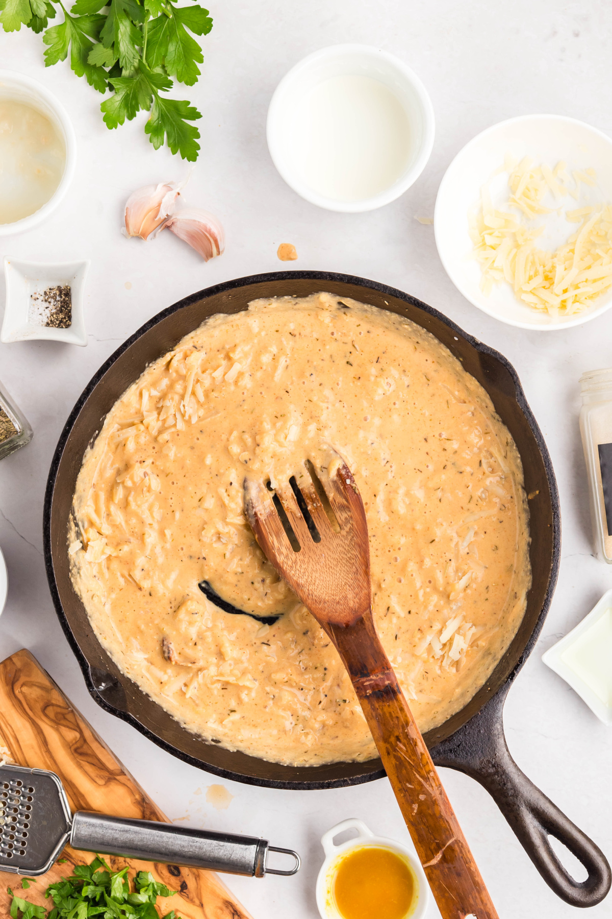 The cheese stirred into the pan.