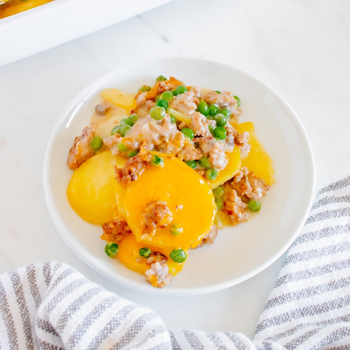 Bowl of Cheesy Sausage Potato Casserole