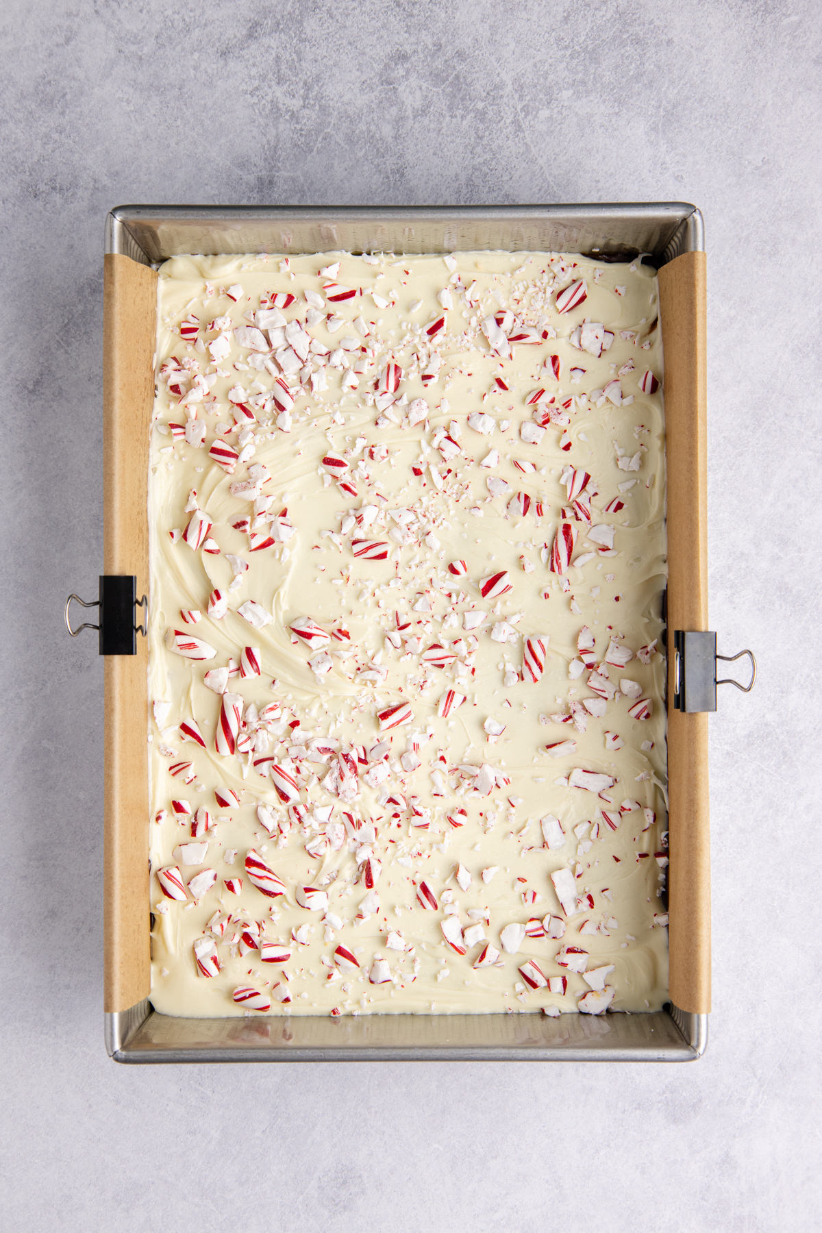 White chocolate spread over the dark chocolate and crushed peppermint candies sprinkled on top.