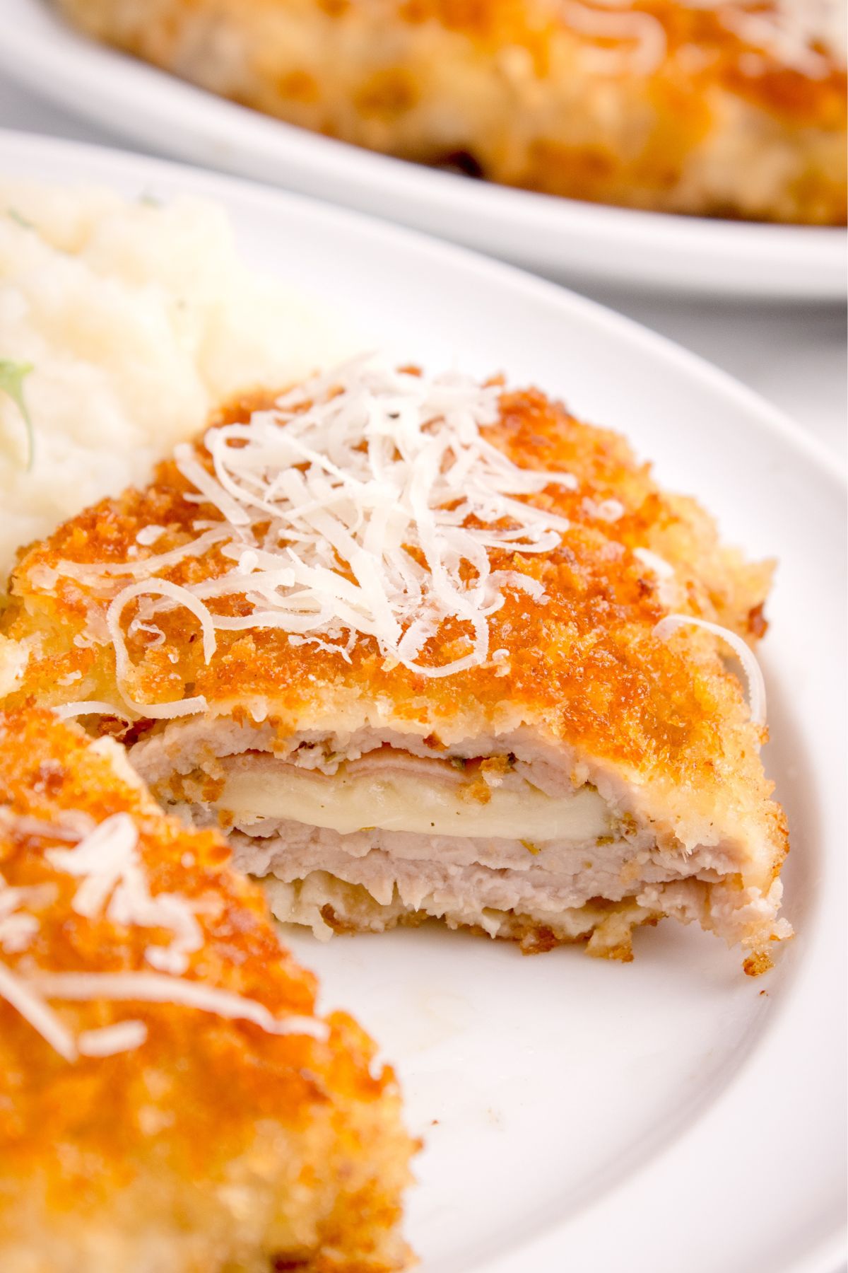 Veal stuffed with cheese and prosciutto with a breaded crust and topped with cheese.