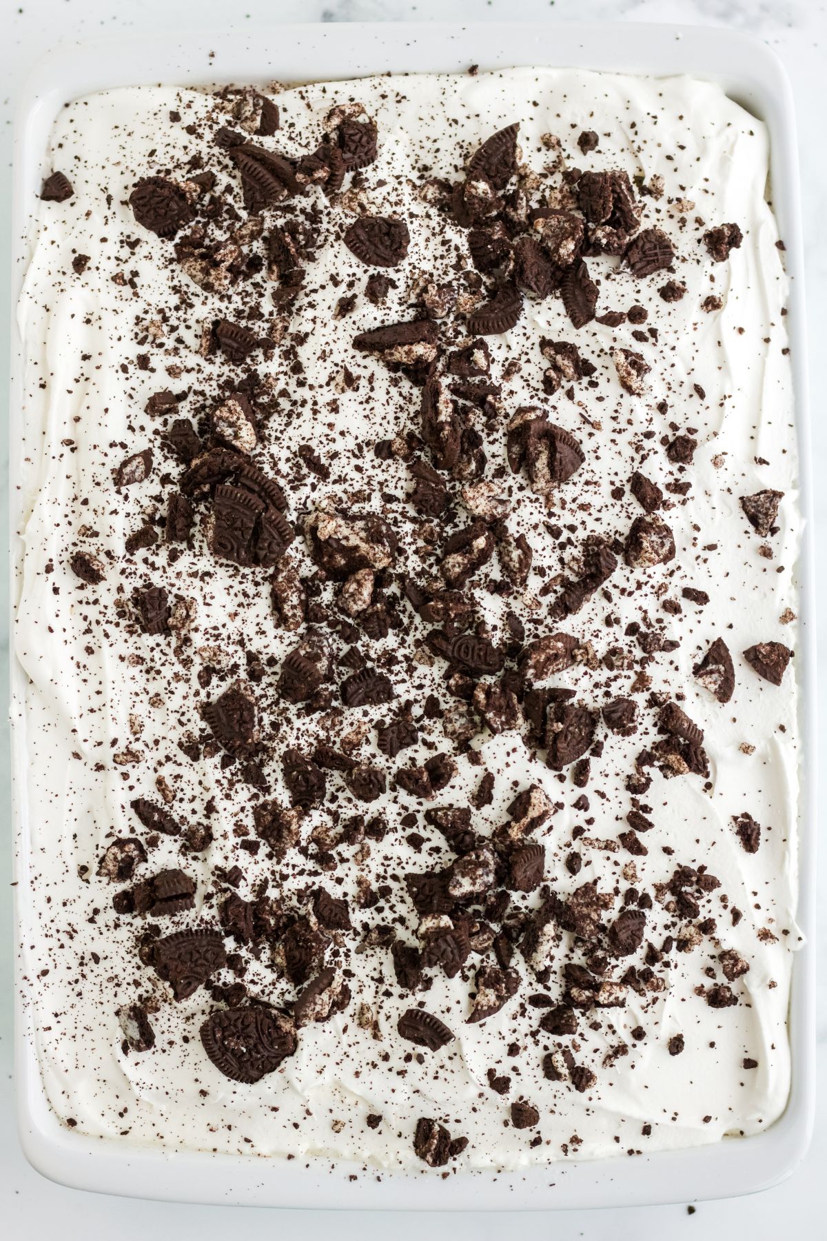 Oreo cookies crumbled over top of the completed cake.