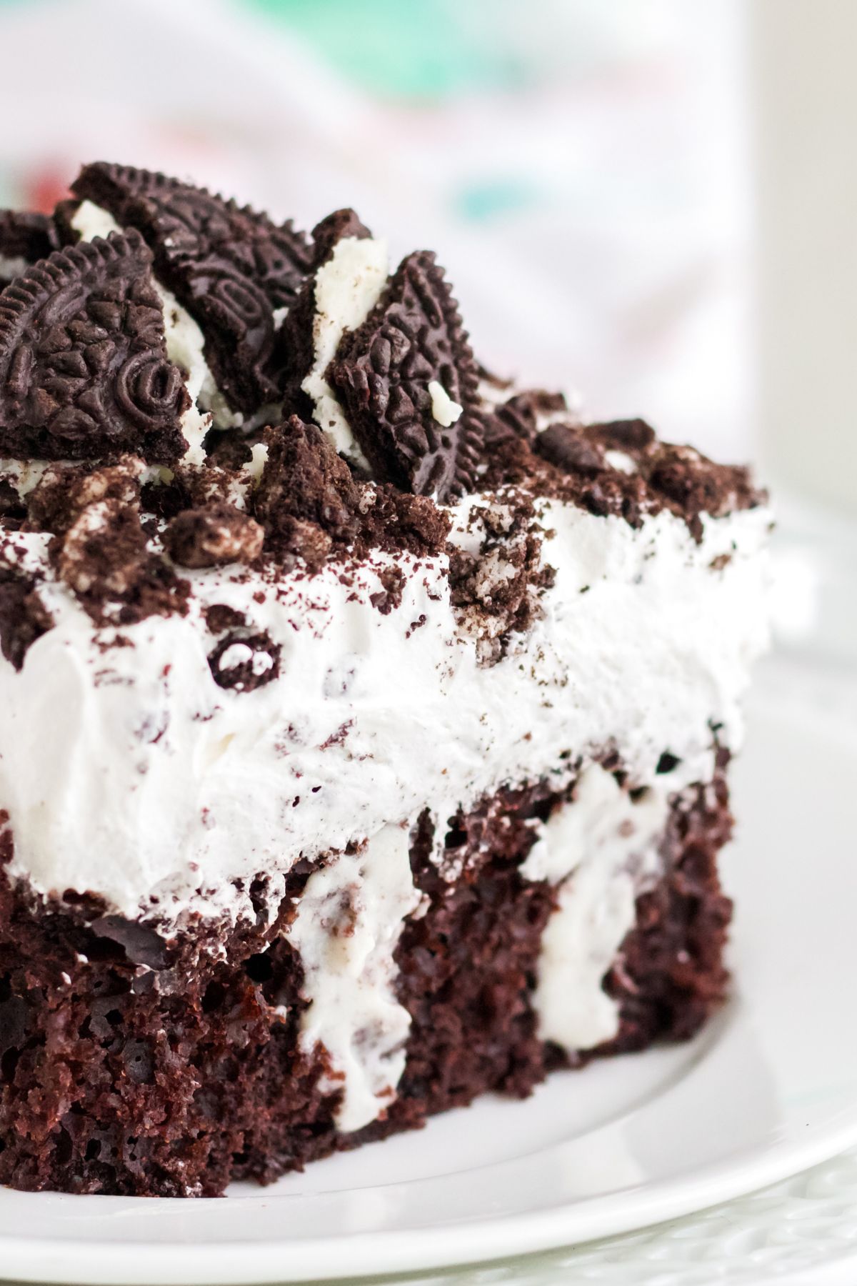 Chocolate cake with rich pudding and oreo on top.