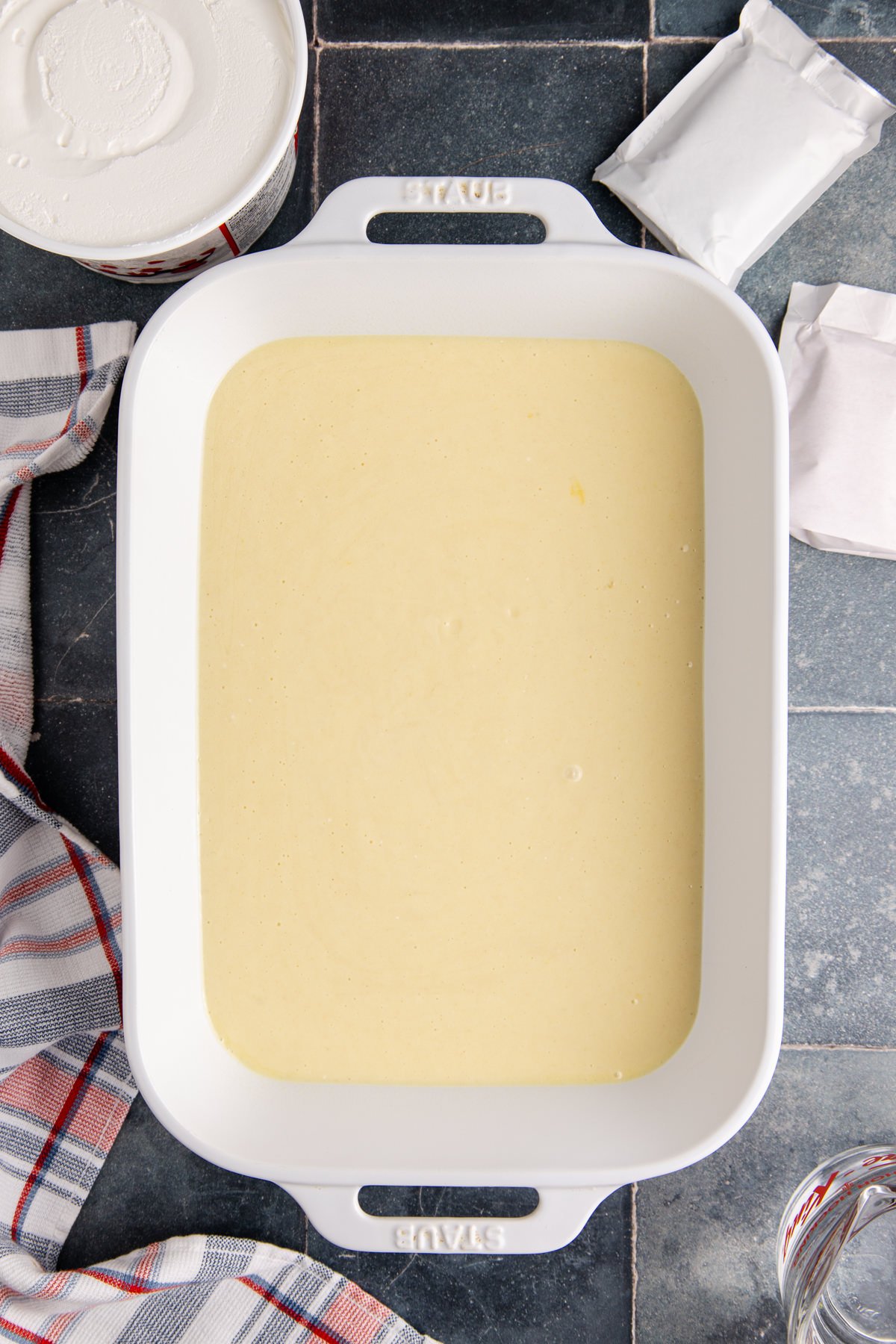 Cake batter added to a prepared pan.
