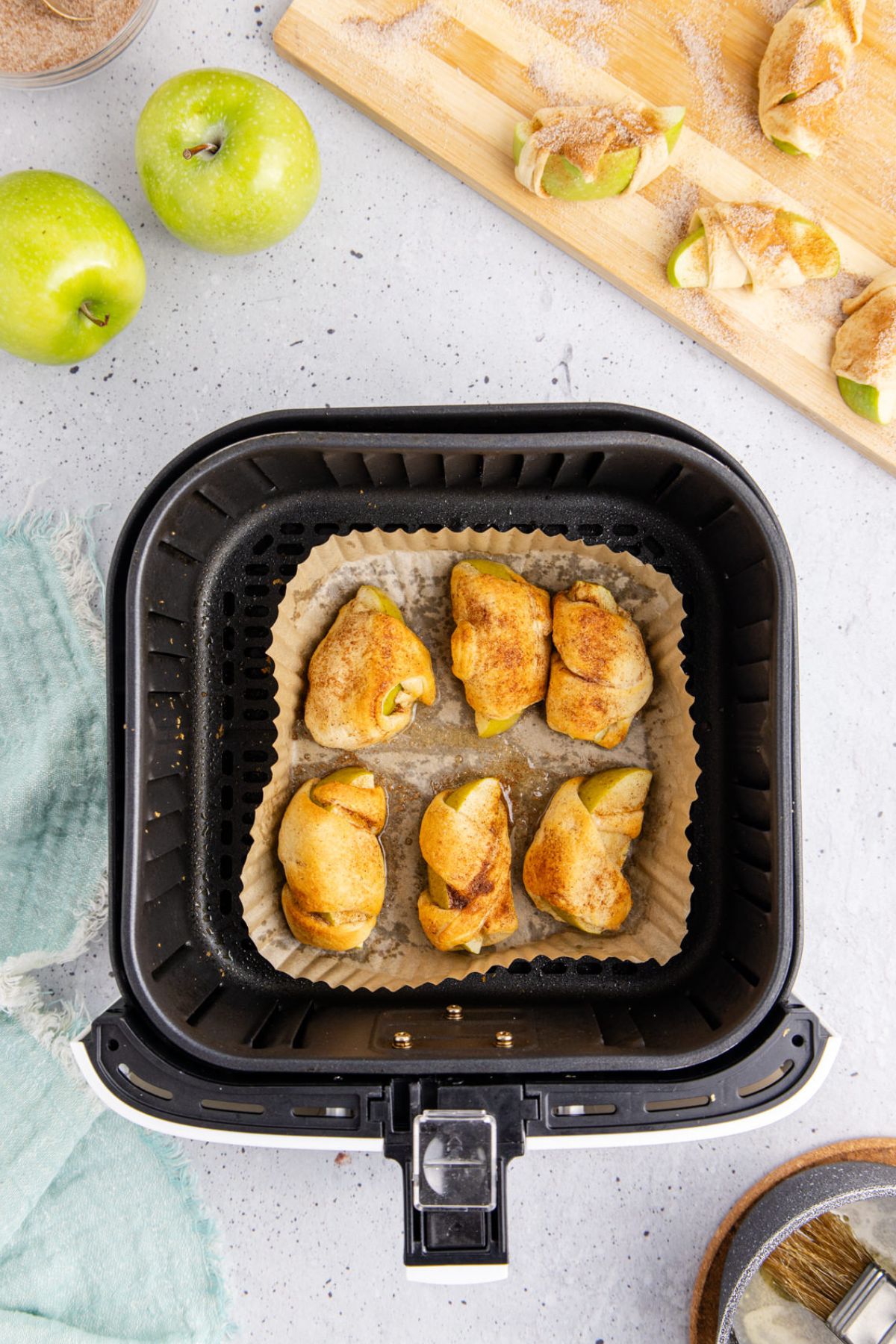Apple dumplings cooking in the air fryer.