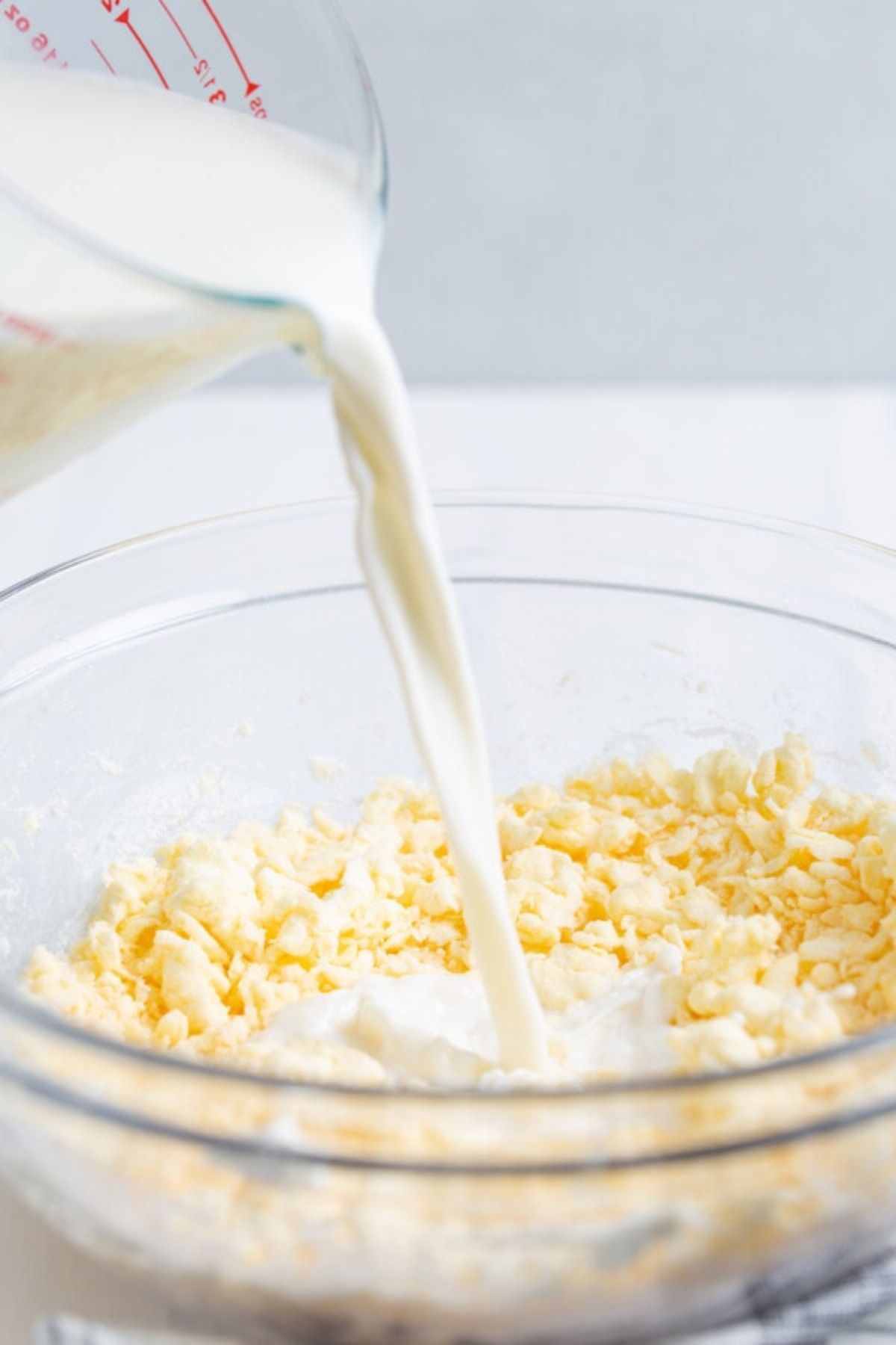 Milk poured into the cream cheese mixture.