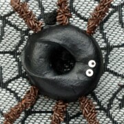Halloween spider donuts on a web.