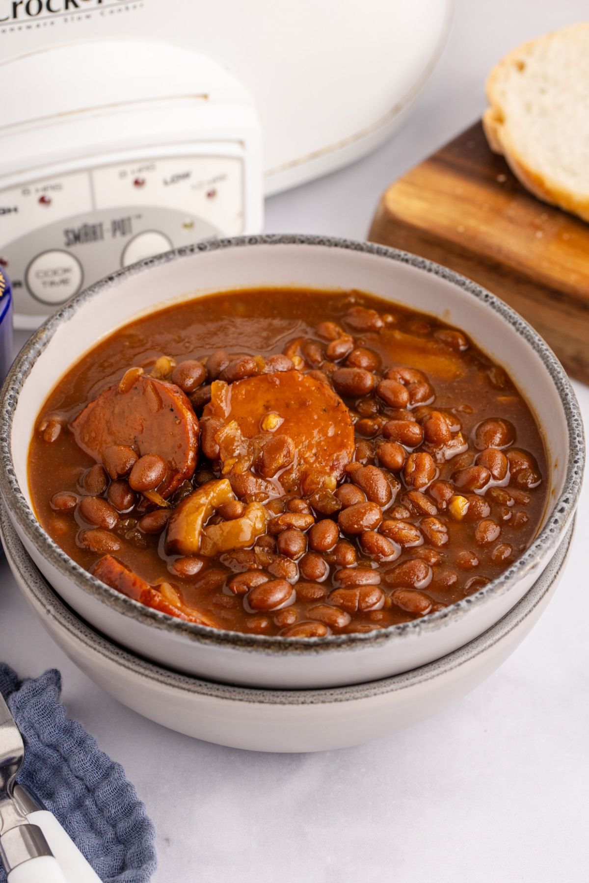 Baked beans with kielbasa in a bowl.