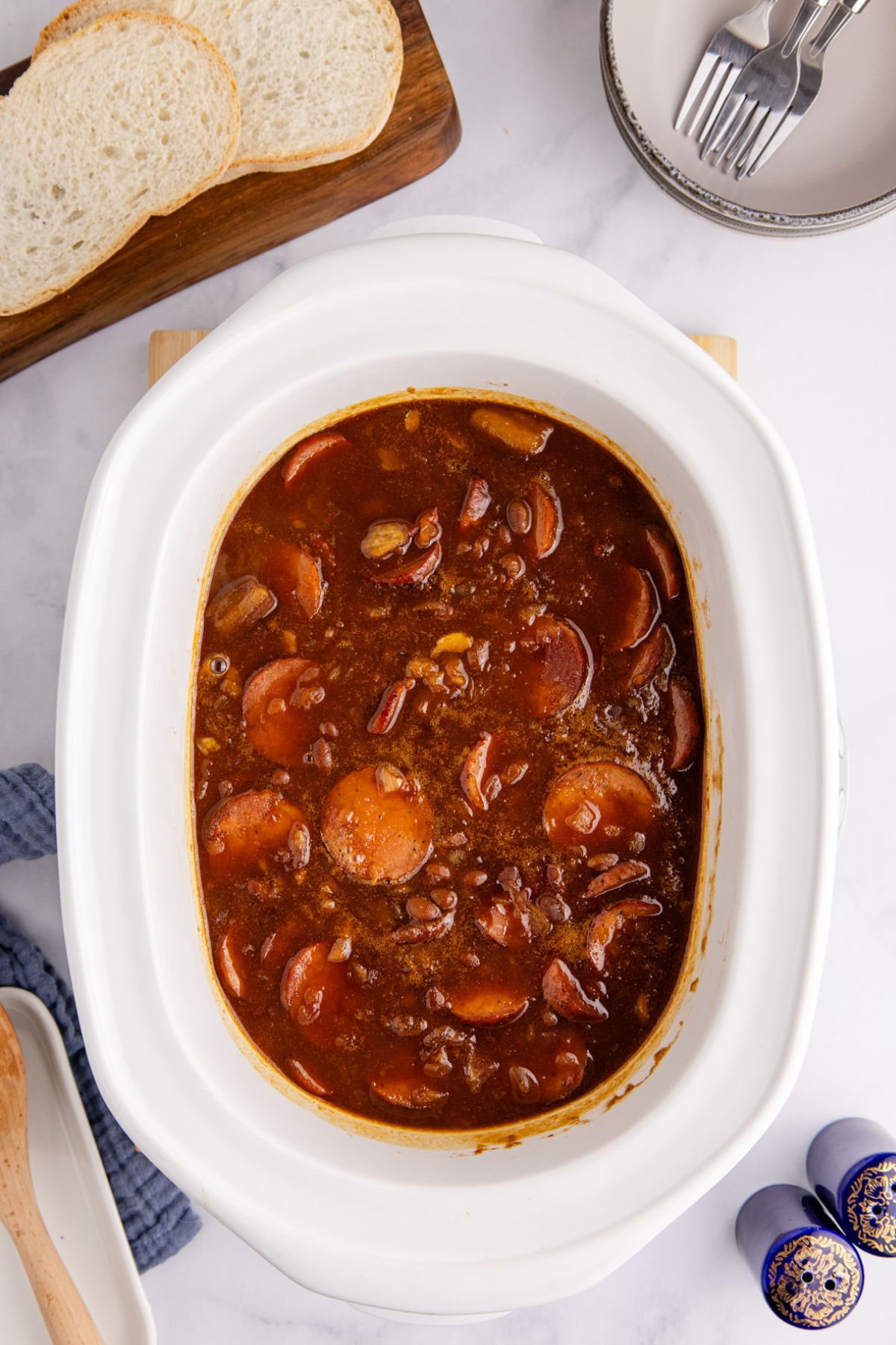 Baked beans with sausage in slow cooker after cooking.