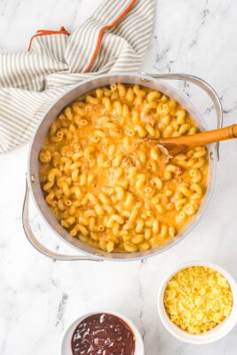 Pasta and cheese cooking inside a pot.