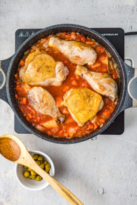 Chicken added to the skillet.