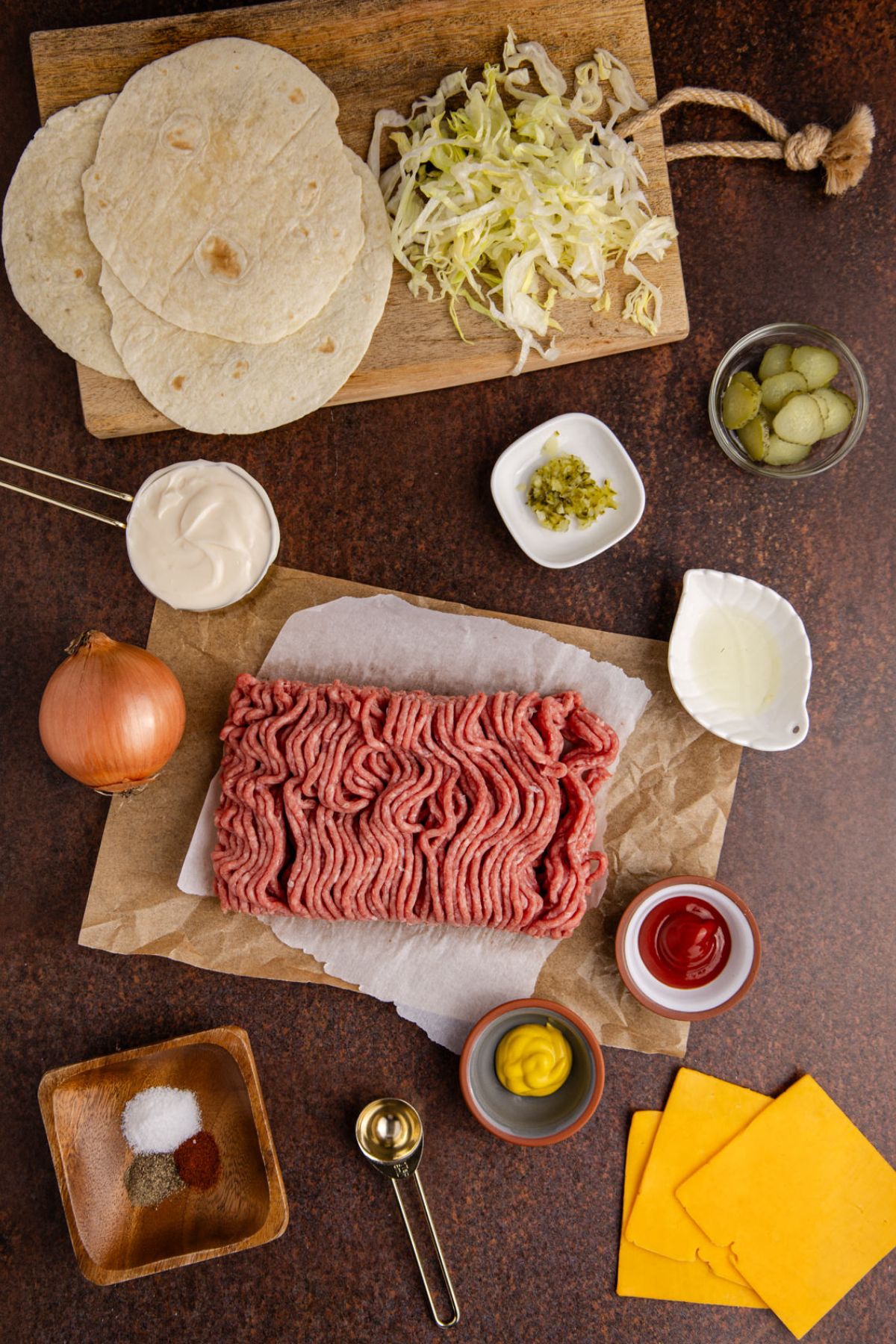 Ingredients for the big mac taco on the table.