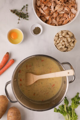 Flour and broth added to the large sauce pan.