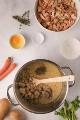 Potato and thyme added to the large sauce pan.