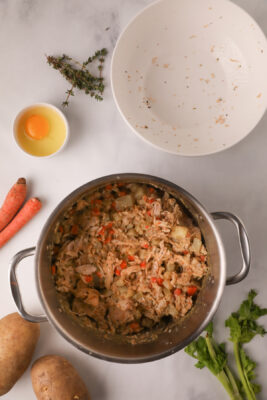 Chicken added to the large sauce pan.