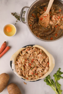 Pie filling added to the pie plate.