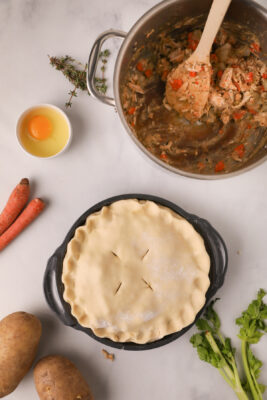 Four cuts created on top of the uncooked pie.