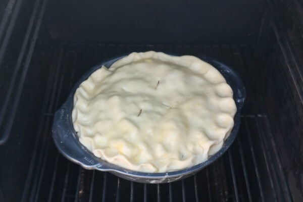 Pie placed inside a smoker.