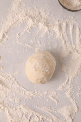 Hand knead dough on the counter top.