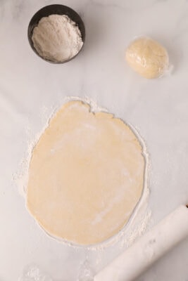Dough rolled into a 12 inch circle.
