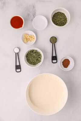 Mayonnaise and buttermilk are mixed together.