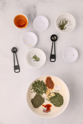 Other ingredients are adde do the bowl to make buffalo ranch sauce.
