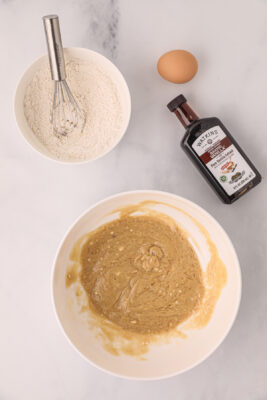Wet ingredients and dry ingredients are mixed together in separate bowls.