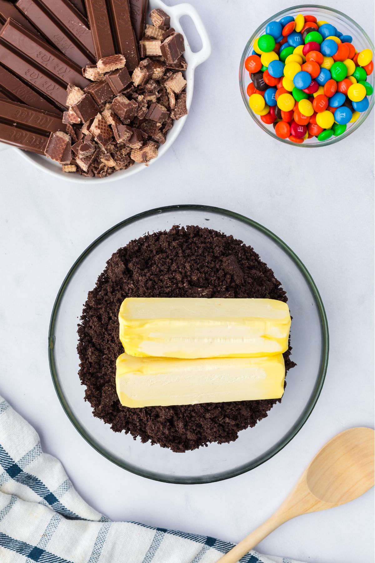 Butter mixed into the oreo crumbles in a bowl.