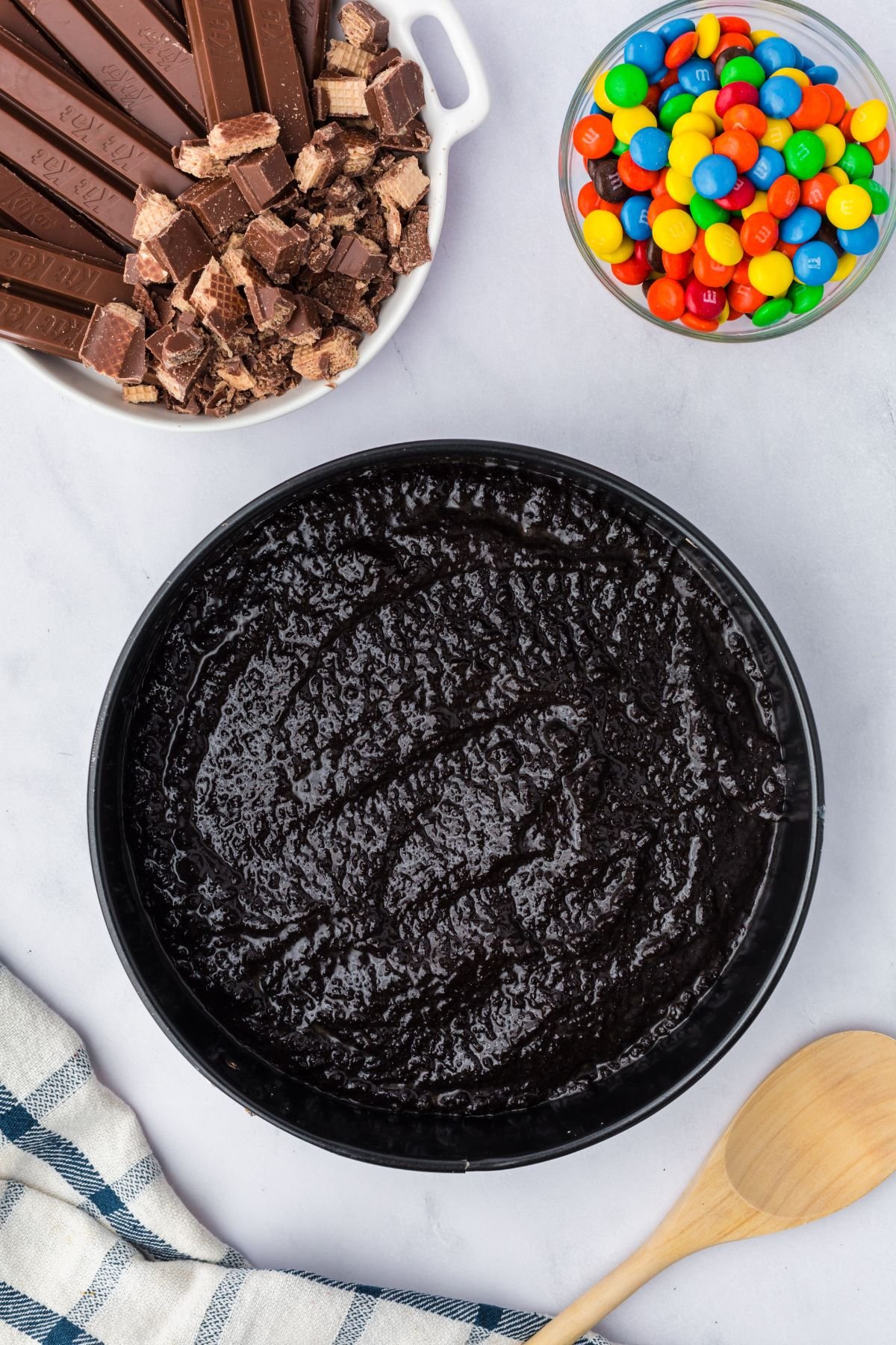 Oreo mixture added into a springform pan.