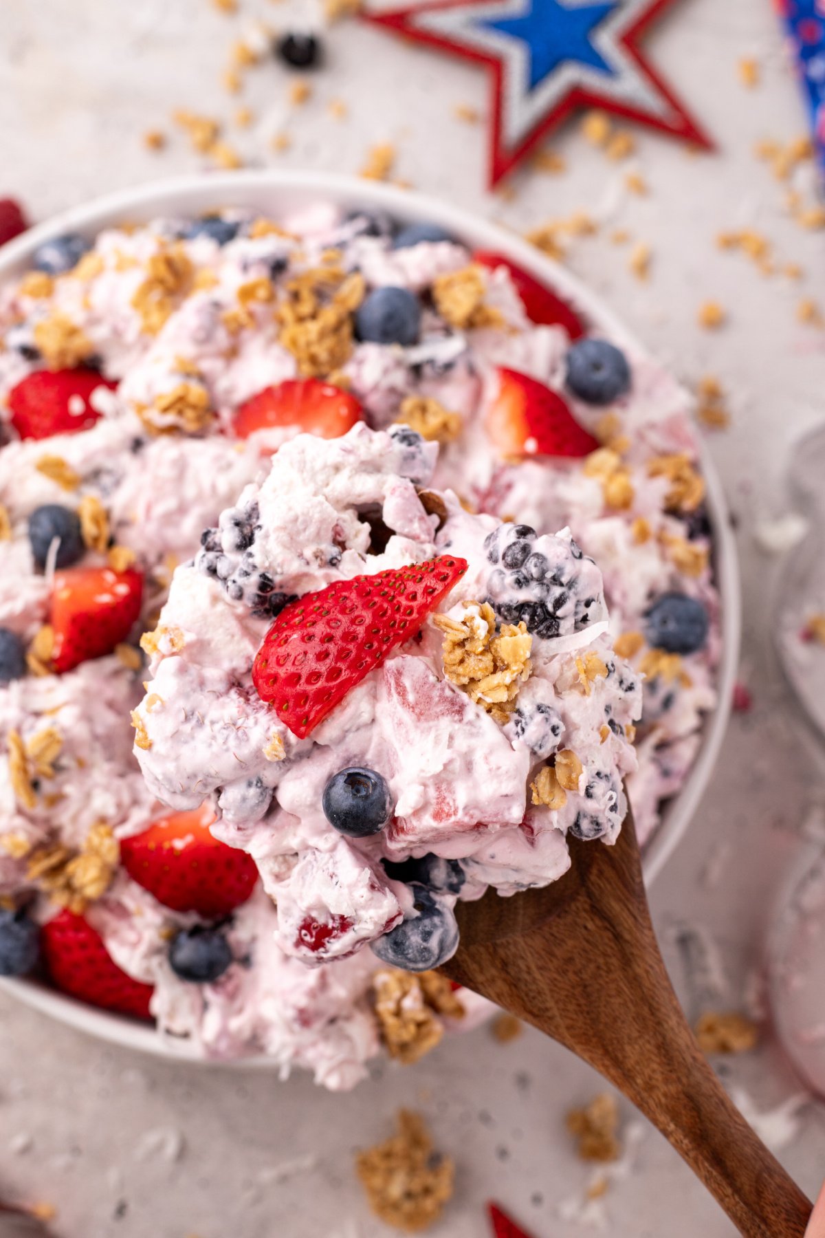 Cheesecake fruit salad with strawberries, blackberries, blueberries, and raspberries.