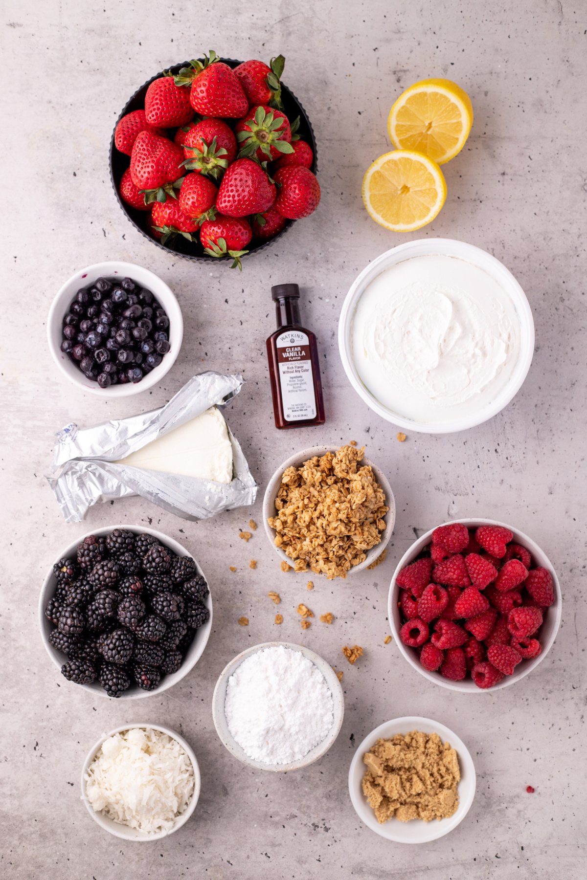 Ingredients for cheesecake fruit salad on a table.