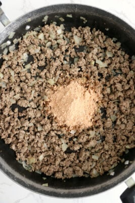 Dry spaghetti sauce mix added to the skillet.