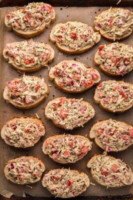 Bruschetta mixture added on top of each slice of baguette.