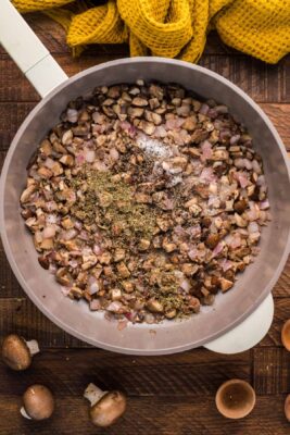 Seasonings added to the skillet of mushrooms.