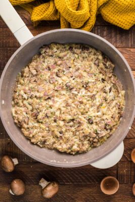 Mushroom topping cooked in a skillet.