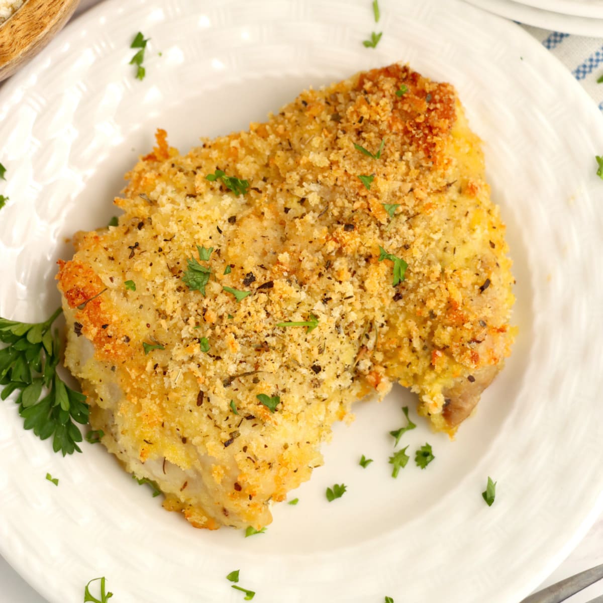 Parmesan Chicken Thighs on a plate 