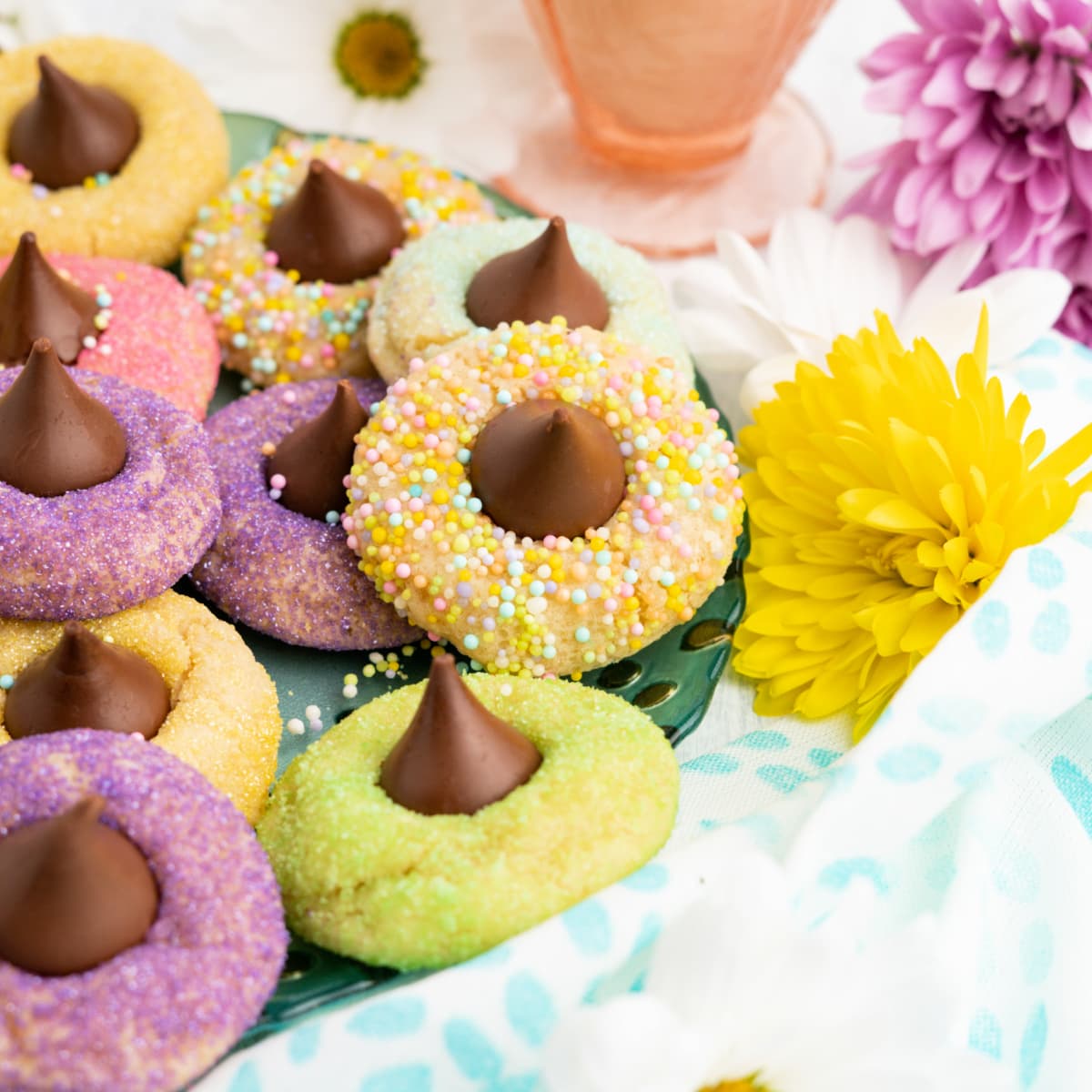 Batch of Sugar Cookie Blossoms with chocolate in the middle 