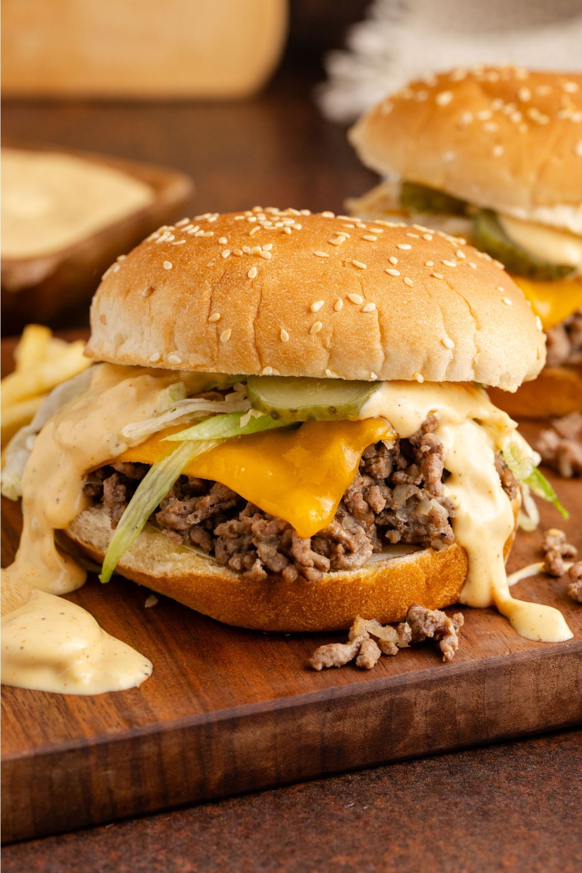 A hamburger bun filled with big mac sloppy joes.