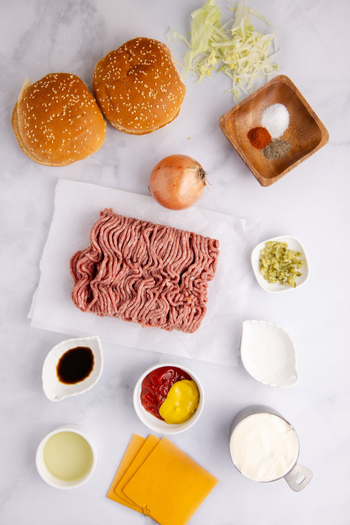 Ingredients for big mac sloppy joes on a table.
